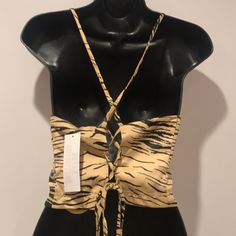 Printed Cropped Top From Urban Outfitters Cut In A Slim Fit With A Tie Closure At The Strappy Back. 97% Polyester, 3% Spandex; Machine Wash; Imported. Bin7-#3 Casual Strappy Crop Top For Party, Chic Tiger Print Tops For Spring, Brown Fitted Crop Top For Vacation, Chic Fitted Strappy Tops, Chic Strappy Tops For The Beach, Chic Strappy Beach Tops, Casual Strappy Top For Night Out, Casual Fitted Top With Tiger Print, Casual Strappy Fitted Crop Top