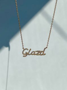 Personalize with any name or word. This necklace is perfect for stacking and make great gifts for friends and family.The Paved Script Nameplate Necklace is dainty yet eye-catching. Encrusted with stones on a dainty thin chain. Perfect for daily wear or on a night out. It will sparkle all day long. ***This item is made to order and will ship out in 4-5 weeks! If your order contains other items, everything will ship together***Material: Full Sterling Silver 925Nameplate Size: 10x30mmLength: 16 or Chain With Name, Nameplate Necklace Gold, Nameplate Necklace Silver, Nameplate Necklace, Affordable Jewelry, The Pouch, Jewelry Pouch, Name Plate, Free Jewelry