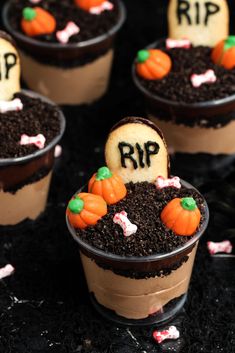 cupcakes decorated with halloween decorations and dirt