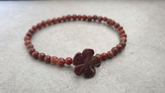 4 mm Red Jasper Flower Round Elastic Beaded Bracelets M a t e r i a l : ♡ 4 mm red jasper ♡ elastic S i z e : please select size S h i p p i n g : ♡ All items shipped worldwide by Thailand post. ♡ Shipped within 2- 3 days after payment received. ♡ Can be upgrade to express mail by a request before payment. You will take : ♡ 15 - 25 days after shipped from Thailand . ♡ 5- 7 days after shipped from Thailand by express mail. Red Bohemian Flower Beaded Bracelets, Red Flower-shaped Bohemian Beaded Bracelets, Bohemian Red Flower Beaded Bracelet, Red Flower-shaped Beads For Gifts, Adjustable Red Flower Beaded Bracelet, Red Flower Shaped Bracelets For Gifts, Handmade Red Flower Bracelets, Bohemian Flower Stretch Bracelet As Gift, Bohemian Flower Stretch Bracelet Gift