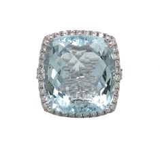 Ladies monumental aquamarine ring with a diamond halo accent the stone and this design is a favorite for any cushion, emerald cut or rectangle cut large aquamarine stone. This traditional aquamarine and diamond ring designed by Michael Christoff. Christoff uses high quality gemstones in gold settings. Aquamarine is the birthstone for those born in March. Whether it's your birthstone, the stone of someone you love or just a favorite, this is your ring. This Aqua darling features a center stone of Formal Light Blue Diamond Ring, Formal Light Blue Aquamarine Diamond Ring, Formal Light Blue Diamond Ring With Center Stone, Elegant Light Blue Aquamarine Diamond Ring, Light Blue Aquamarine Ring With Brilliant Cut, Light Blue Topaz Ring With Diamond Halo Setting, Light Blue Topaz Halo Ring With Diamonds, Fine Jewelry Aquamarine Diamond Ring In Light Blue, Light Blue Aquamarine Diamond Ring