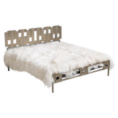 a white sheepskin bed with metal frame and foot board