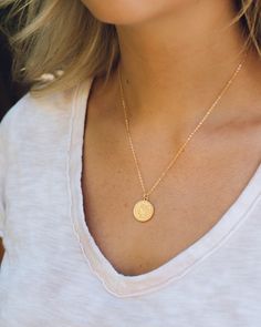 "While you can't use this coin in a store, you can wear it everyday for the perfect accessory. Each necklace is handcrafted with uniqueness.  Chain - 17.5\"  -16K gold plated over brass Plated jewelry is a wonderful, affordable way to add a sophisticated look to your wardrobe, with the look of real gold. It is also an excellent choice for people with sensitive skin. Gold Coin  - Material: Copper, 18K Gold Filled - Size: 20 mm x 15 mm - Quantity: 1 piece - Color: Gold" Everyday Gold Plated Medallion Jewelry, Hammered Yellow Gold Medallion Necklace As A Gift, Everyday Gold Plated Coin Jewelry, Hammered Yellow Gold Medallion Necklace Gift, Everyday 14k Gold Filled Coin Pendant Jewelry, Spiritual Brass Coin Necklace With Round Pendant, Everyday Brass Jewelry With Coin Pendant, Round Brass Coin Necklace, Tarnish Resistant, Dainty Brass Medallion Jewelry