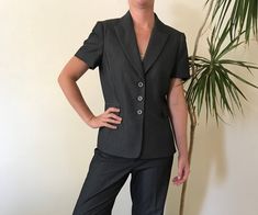 A classic Tahari by Arthur S. Levine pinstriped pantsuit in dark grey. Size 4P. Great quality suite in perfect condition. Semi-formal Fitted Short Sleeve Suits, Fitted Pinstripe Suits For Work, Fitted Short Sleeve Business Blazer, Fitted Short Sleeve Blazer For Business, Womens Suits, Tucson Az, Grey Shorts, Tucson, Suits For Women