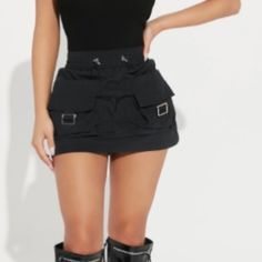 Never Worn From Fashion Nova.Too Small For Me. Nylon Cargo Mini Skirt And It’s Super Mini Btw. Y2k Style Black Skirt With Pockets, Casual Nylon Mini Skirt, High Waist Skirt With Pockets For Club, Trendy Mini Skirt With Pockets For Club, Club Mini Skirt With Pockets, Spring Casual Nylon Mini Skirt, Trendy Black Mini Skirt For Streetwear, Black Mini Length Streetwear Bottoms, Black Stretch Skirt For Streetwear