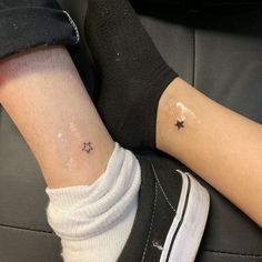 a person with a small star tattoo on their left ankle, sitting in a car