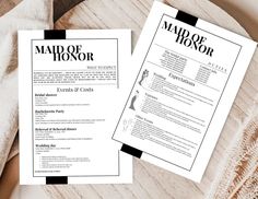 two resumes sitting on top of a wooden table