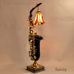 a saxophone lamp is sitting on top of a table