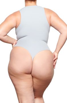 Sculpt your body's natural shape with a high-neck bodysuit from Kim Kardashian West's SKIMS that holds you in and lifts you up in all the right places. Reflecting the brand's passion for highly technical shapewear solutions for every body, this everyday piece has whisper-soft, seamless construction, high-cut legs and a thong back that remains invisible under clothing. Snaps between legs Crewneck Sleeveless Lined 76% polyamide, 24% elastane Machine wash, tumble dry Imported Women's Clothing Seamless High-cut Leg High Stretch Bodysuit, Sleek Second-skin Bodysuit With High-cut Leg, Seamless High-cut High-stretch Bodysuit, Sleek High Cut High Stretch Bodysuit, Sleek Compressive Smoothing Bodysuit, Supportive High Stretch Seamless Shapewear, Fitted Smoothing Bodysuit With High-cut Leg, Fitted High-cut Leg Smoothing Bodysuit, Smoothing Fitted Bodysuit With High-cut Leg