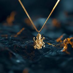 Elevate your style with our Ganesh pendant. This solid gold Ganesh necklace captures the essence of the Elephant. PENDANT INFORMATIONThis pendant is made of real, solid gold.• Made in USA• Material: 14k or 18k solid gold• Finish: polished• Height: 1.25" (32 mm) x Width: 0.9" (22,5 mm)• Pendant weight: approx. 6 grams (14k)• Bail: fits up to 4 mm chains• Solid back, not hollow• A certificate of authenticity is included• Delivered in our elegant jewelry box, making it the perfect gift Shipping: Al Ganesh Necklace, Ganesh Pendant, Elephant God, Phoenix Pendant, Gold Chain Design, Gold Medallion, Gold Dragon, Gold Locket, Solid Gold Chains