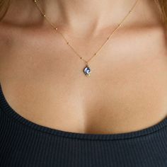 A stunning, deep blue, rose cut sapphire, wrapped in 22k gold shines with a trio of diamond accents, each set in a 22k gold dot. This lovely pendant is suspended from a 14k gold dot chain, with 14k lobster clasp. Setting measures approximately 3/8 inch x 1/2 inch. Sterling silver back. matte finish. Necklace With Diamonds, Gold Dot, Gold Dots, Teardrop Necklace, Sapphire Necklace, Blue Rose, 22k Gold, Rose Cut, Chain Lengths