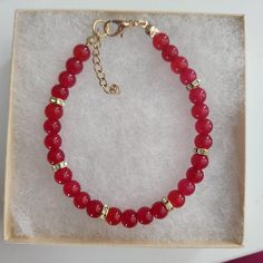 Red Round Bead Bracelet ,Holiday, Christmas Bracelet, Red Glass Beads ,Glass Bead Bracelet, Glass Bead Bracelet, Gold Rhinestone Spacers. Approximately 7 inches, make sure this will fit your wrist. Beads used are 6 mm in diameter  All my bracelets are handmade. Please note -  I do my very best to give you accurate measurements and descriptions All my jewelry is delivered in a gift box and beautiful organza gift bag, perfect for keeping your jewelry safe, or ready to give if it is a gift! No refunds or exchanges * see more brackets at https://decowrist.etsy.com/ Bracelets Red, Glass Bead Bracelet, Jewelry Safe, Christmas Bracelet, Bracelet Ideas, Glass Beaded Bracelets, Gold Rhinestone, Organza Gift Bags, Bracelet Gold