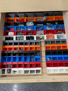 the drawers are filled with many different types of screws