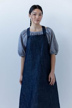 The Noemi Apron Dress is ready for the summer picnic. Featuring a square neckline, pockets, and side button closure. Model is wearing size SMALL standard length. Model is 5'8". Please review our size guide prior to ordering. Need specific measurements? Send us an email and we will be happy to help you find the perfect fit. Spring Denim Dress With Square Neck, Spring Square Neck Denim Dress, Everyday Summer Dresses With Buttons, Summer Bib Front Dress With Pockets, Casual Spring Pinafore Dress For Daywear, Everyday Blue Dresses With Pockets, Everyday Blue Dress With Pockets, Dyed Linen, Apron Dress