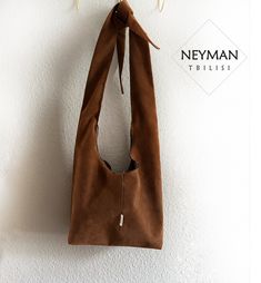 This one of a kind handmade boho bag made from a very high quality artificial vegan suede leather will attract everybody's attention. It is very lightweight and comfortable for use, with an inner side pocket for quick access to necessities. Perfect for a variety of activities; you can take it to work, shopping or even to the party. The bag closes with the zipper and the handle is adjustable your liking height. Dimensions: 16.1x14.1 in / 41x36 cm Washing instructions: dry cleaning (recommended) o Chic Brown Suede Hobo Bag, Rectangular Brown Hobo Bag With Suede Lining, Suede Bucket Bag With Removable Pouch, Suede Bucket Shoulder Bag With Removable Pouch, Brown Suede Bucket Bag For Everyday Use, Brown Suede Bucket Bag For Daily Use, Rectangular Suede Hobo Bag For Everyday Use, Everyday Rectangular Suede Hobo Bag, Suede Hobo Bag With Removable Pouch