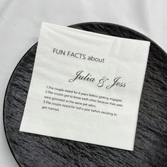 a black and white plate with a napkin on it that says fun fact about julia & jesus