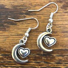 Cute, Dainty, Simple And Fun! Brand New Silver Metal Alloy Crescent Moon And Valentine Heart Shaped Dangle Earrings. Adds A Subtle Sweet Splash Of Shine To Any Look, Perfect For Summer! Makes An Excellent Gift Lots Of Options! Bundle Any Three Pairs Of Earrings Labeled 3/$15 And I’ll Accept Your $15 Offer. 20% Off 3+ Items And I Consider Trades Cute Heart-shaped Metal Earrings, Adjustable Nickel-free Heart Earrings, Adjustable Dangle Heart Earrings, Nickel Free, Adjustable Metal Heart Earrings, Adjustable Heart-shaped Earrings, Metal Heart Dangle Earrings, Pink Pearl Earrings, Mexican Earrings, Gold Bead Earrings