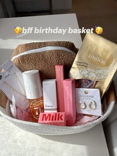 a white basket filled with lots of different items