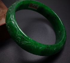 Vintage 59mm Hand-carved Green Jadeite Jade Bangle Bracelet #136 Size: 59 mm x 17mm x 9mm No certificate provided. Very nice condition. Want additional photos or have questions, just ask! Jade Bangle Bracelet, Bangle Box, Silk Necklace, Jade Bangle, Jade Bracelet, Jade Jewelry, Jade Pendant, Vintage Bracelets, Pretty Jewellery