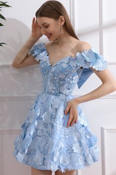 Indulge in the luxurious and exclusive style of our Off the Shoulder Floral Embroidery Sky Blue Mini Dress. The delicate floral embroidery adds a touch of sophistication, while the off the shoulder design exudes elegance. With its sky blue hue, this dress is perfect for any occasion. Elevate your wardrobe with this must-have piece. Bust and Skirt with full lining. 100% Polyester 100% Recycled polyester lining Concealed zip at center back Imported Light Blue Sweetheart Neckline Dress For Banquet, Elegant Light Blue Dress With Floral Applique, Off-shoulder Floral Applique Party Dress, Fitted Blue Off Shoulder Dress For Gala, Fitted Blue Off-shoulder Dress For Gala, Light Blue Off-shoulder Prom Dress, Blue Lace Evening Dress For Banquet, Blue Fitted Off-shoulder Dress For Wedding, Blue Floral Applique Prom Dress