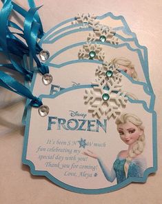 frozen birthday card with blue ribbon and snowflakes