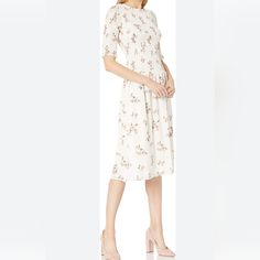 Excellent Condition No Flaws Noted. Fitted Feminine Rayon Midi Dress, Feminine Rayon Midi Dress For Garden Party, Relaxed Fit Floral Print Day Dresses, Floral Print Relaxed Fit Dress For Daywear, Feminine Rayon Dress For Daywear, Modest White Floral Dress For Spring, Feminine Knee-length Rayon Dress, White Floral Print Mid-length Dress, White Flowy Rayon Dress