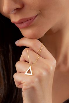 Dainty Gold Triangle Geometric Necklace, 14k 18k 10k Minimalist Gold Necklace, Christmas Gift for Her, Teacher Appreciation Gift Jewelry FEATURES * Solid Gold (real gold, not gold plated or gold filled material) * Gold Karat: 10K (417) - 14K (585) - 18K (750) (optional) * Pendant Height 0.62 Inches (1.58 cm) * Pendant Width 0.68 Inches (1.72 cm) Our gold necklaces are perfect choice for a Christmas, Mother's Day, valentine's day, birthday, wedding, anniversary, graduation, engagement, bridesmaid Minimalist White Triangle Jewelry, Gold Triangle Jewelry For Formal Occasions, Minimalist 14k Gold Clavicle Chain Necklace, Triangle Necklace With Adjustable Chain For Gift, Minimalist 14k Gold Clavicle Necklace, Elegant Gold Triangle Necklace, Elegant Triangle Yellow Gold Jewelry, Elegant Yellow Gold Triangle Jewelry, Simple 14k Gold Necklaces