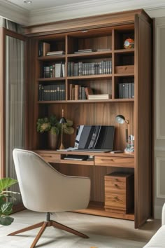 a chair and desk in front of a wooden bookcase with books on the shelves