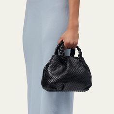 HEREU "Bombon" shoulder bag in woven leather  Top handles  Adjustable shoulder strap, 53.1"L Can be worn as a top handle or shoulder/crossbody bag  Open top with magnetic closure; side snap closure  Approx. 6.7"H x 11"W x 4.3"D Item Weight (Lbs.): 1.1 Made in Spain Evening Woven Leather Handheld Bag, Formal Satchel With Braided Handles, Versatile Evening Shoulder Bag With Braided Handles, Evening Shoulder Bag With Double Handle In Woven Leather, Evening Shoulder Bag With Double Handle And Woven Leather, Evening Satchel With Braided Handles Crossbody, Evening Satchel With Braided Handles, Chic Evening Satchel With Woven Leather, Evening Double Handle Woven Leather Shoulder Bag