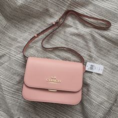 New Coach Brynn Flap Crossbody C5632 Gold/Shell Pink $350 Crossgrain Leather Inside Zip Pocket Buckle Closure, Fabric Lining Outside Zip And Open Pockets Adjustable Strap With 21 1/2" Drop For Shoulder Or Crossbody Wear 9 3/4" (L) X 7" (H) X 3 1/4" (W) Pink Cute Purse, Coach Purses For Teens, Elegant Spring Bags With Branded Hardware, Feminine Bags With Branded Hardware, Classic Blush Evening Bag, Pink Chanel Bag, Pink Coach Bag, Sling Bags Women, Vintage Leather Handbag