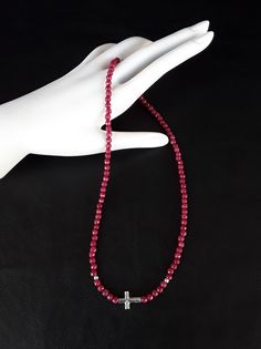 The Ruby Silver Cross Necklace is a unique Catholic Necklace that is based on the foundations of ruby which symbolizes the Divine creativity as well as mental and physical health (all stones have been purified and cleansed). On top of that, as its central pillar is a Cross made of pure 925 Silver; and since our Christ - among other things - symbolizes purity only 925 pure Silver was used. What is more, the silver materials that where utilized in the creation of the Necklace are all 925 pure Silv Red Faceted Spiritual Jewelry, Spiritual Garnet Jewelry, Symbolic Red Gemstone Jewelry, Handmade Ruby Necklaces With Spiritual Style, Spiritual Ruby Jewelry With Natural Stones, Handmade Ruby Spiritual Necklaces, Handmade Spiritual Ruby Necklaces, Red Sterling Silver Cross Necklace, Red Cross Necklace In Sterling Silver