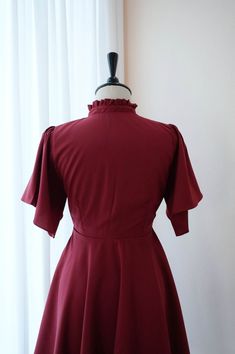 Fitted Midi Dress With Empire Waist For Bridesmaids, Fitted Short Sleeve Mini Dress For Bridesmaids, Solid Color Dresses With Lined Fitted Bodice, Elegant Fitted Vintage Dress In Solid Color, Solid Bridesmaid Dresses With Ruffles, Elegant Solid Color Fitted Vintage Dress, Fitted Bridesmaid Dress With Back Zipper, Fitted Dress With Back Zipper For Bridesmaid, Elegant Red Vintage Dress With Short Sleeves