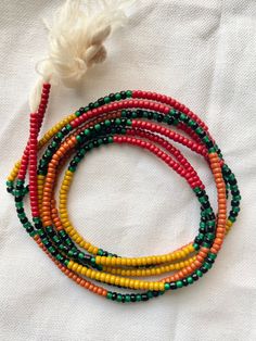 Hello! I make quality beaded jewelry while using color therapy to heal the body and spirit. These are intended as traditional African tie waist beads but are multi-functional. You can wear them as a necklace, anklet or bracelet. Color: Topaz: sacral and root chakra stimulation and protection. The default size is 44in. but are made to measure.  Beads are made with nylon string and seed bead.  Thank you for your  support and business you are greatly appreciated! *All beads can be returned or exchanged as long as the string bead is returned in it's original state. No broken beads returned will be honored for exchange or refund. Thank you! Holistic Necklaces With Wooden Beads For Festivals, Holistic Festival Necklaces With Wooden Beads, Bohemian Hand-strung Waist Beads With Round Beads, Orange Spiritual Beaded Bracelets For Festivals, Spiritual Orange Beaded Bracelets For Festivals, Spiritual Multicolor Waist Beads With Tiny Beads, Spiritual Round Beaded Bracelets For Festivals, 108 Beads For Festivals, Spiritual Multicolor Round Waist Beads