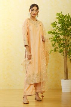 Beige pure raw silk kurta with floral and mirror hand embroidery. Comes with pant and a pure organza shaded dupatta.
Components: 3
Pattern: Hand embroidered
Type Of Work: Floral, Mirror
Neckline: Round
Sleeve Type: Three quarter
Fabric: Pure raw silk, Dupatta : Pure organza
Color: Beige
Other Details: 
Scalloped detailing on dupatta
Occasion: Mehendi and Haldi,Sangeet - Aza Fashions Semi-stitched Slub Silk Sets With Dori Work, Raw Silk Palazzo Set With Straight Kurta, Straight Kurta Raw Silk Palazzo Set, Designer Tussar Silk Palazzo Set With Resham Embroidery, Traditional Chanderi Palazzo Set With Gota Work, Traditional Chanderi Sets With Gota Work, Traditional Drape Chanderi Palazzo Set With Gota Work, Chanderi Sets With Gota Work In Traditional Drape, Festive Tussar Silk Palazzo Set With Resham Embroidery