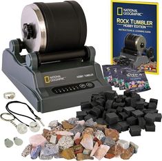 the rock tumbler machine is surrounded by rocks and other items to make it work