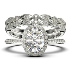 an oval shaped diamond ring set with two matching bands