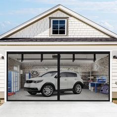 a car is parked in the garage with its door open and it's reflection on the glass