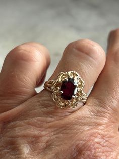 Vintage genuine garnet solitaire ring Size 5 3/4 Fine jewelry Gold plated, pure silver ring, and setting Genuine oval garnet stone measures 8 x 6 mm with a 3 mm depth Basket setting Rope accent, upper shank and setting Gorgeous stone Yellow gold plating 1970 through 1980s ring January birthstone Handset by experience jeweler Star seller shop Over 600 pieces sold on Etsy Fast and free shipping Ring Basket, January Birthstone Rings, Basket Setting, Spring Hill, January Birthstone, Garnet Ring, Garnet Stone, Ring Oval, Garnet Rings