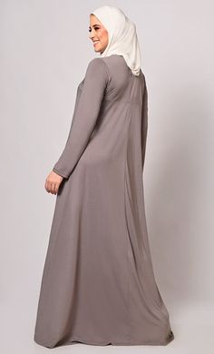 Inclusive Experience. Exclusive Quality.Elevate your modest fashion with our Flared Full Sleeves Abaya, a timeless piece that combines elegance, comfort, and modesty. This Abaya is designed to provide both style and coverage for women who appreciate traditional Islamic clothing. Our Abaya features a graceful flared design, Front yoke with pin tuck pleats, round neck, full sleeves and pockets on both the sides to provide maximum utility. Elevate your fashion while staying true to your values. Siz Solid Long Sleeve Maxi Dress For Eid, Elegant Abaya With Modesty Panel For Fall, Elegant Fall Abaya With Modesty Panel, Fitted Long Abaya With Modesty Panel, Modest Solid Color Floor-length Abaya, Modest Maxi Length Abaya For Fall, Modest Floor-length Abaya, Fall Season Modest Maxi Length Abaya, Fall Modest Maxi Length Abaya