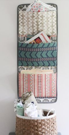 the wall hanging organizer is organized with fabric