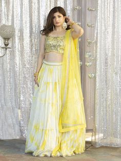 Go all out in this whimsical lehenga, studded with precious mirror, pearl, stone, embroidery work, which is sure to bring out the innate grace and grandeur in you! Color - Lemon Yellow Fabric & Work Style - - Silk blouse: mirror, pearl, stone, embroidery work. - Soft net lehenga: mirror, pearl, stone, embroidery work. - Soft net dupatta: embroidery work. Details - - Assured quality - Wash care instruction: Dry clean only. - Slight variation in color is possible due to digital photography. Hand Embellished Georgette Palazzo Set For Wedding, Wedding Hand Embellished Georgette Palazzo Set, Hand Embellished Unstitched Palazzo Set For Wedding, Unstitched Hand Embellished Sets For Diwali, Hand Embellished Unstitched Sets For Diwali, Anarkali Style Hand Embellished Palazzo Set For Wedding, Navratri Hand Embellished Dupatta, Semi-stitched Hand Embellished Choli For Eid, Hand Embellished Palazzo Set For Wedding On Eid