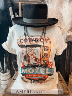 Cowboy Bar Motel - roadside motel with TV and Phone. Come rest for the long rodeo trail. Crew Neck | Short Sleeve | Unisex Fit Bella Canvas Material: 100% CottonSmall (2/4) | Medium (6/8) | Large (10/12) | XL (14/16) | 2XL (18/20) Retro Tops For Western-themed Summer Events, Retro Summer Tops For Western-themed Events, Vintage Tops For Fall Country Concerts, Roadside Motel, Cowboy Bar, Cowboys Bar, Cowgirl Chic, Western Outfits, Country Girls