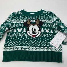 New With Tags $30.00 Msrp Get Ready For The Holiday Season With This Adorable Disney Jumping Beans Sweater Featuring Mickey Mouse! Made From A Comfortable Cotton Blend Knit Fabric, This Pullover Sweater Is Perfect For Keeping Your Little One Warm During The Winter, Fall, And Spring Seasons. The Fair Isle Pattern Adds A Festive Touch, While The Long Sleeves Provide Extra Coverage. Care For This Sweater Is A Breeze With Its Machine Washable Design, And Its Unisex Baby & Toddler Department Makes It Green And White Sweater, Mouse Christmas, Mickey Christmas, Mickey Mouse Christmas, Disney Sweaters, Fair Isle Pattern, Jumping Beans, Disney Christmas, Disney Shirts