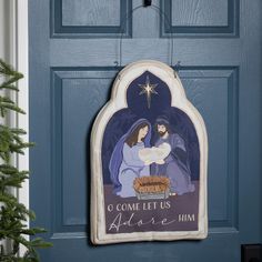 a nativity scene is hanging on the front door