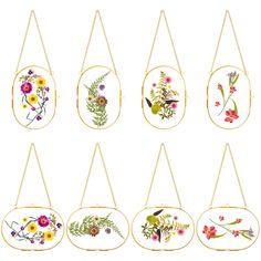 six floral paintings hanging from gold chains on a white background, each with different flowers