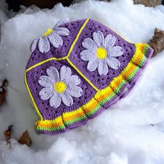 Would you like to spread positive energy around you with colorful floral motifs?  This knitted crochet daisy motif bucket hat is for you. In festivals, concerts, on the streets, in short, wherever there is life, all people will watch you. Cotton knitted hats  combined with these vibrant colors are waiting for their owners. Avaliable in any size of colour, custom orders always welcome Message for any enquires Visit our shop for more crochet hat items. Embrace the charm of nature with our lovely Knitted Daisy Bucket Hat. Handcrafted with care and adorned with adorable daisy motifs, this hat is the perfect blend of style and comfort. Designed to keep you stylishly shaded on sunny days, this bucket hat adds a touch of whimsy to any outfit. The soft, cozy, and breathable knit ensures a comforta Cute Multicolor Hand Knitted Crochet Hat, Cute Multicolor Hand-knitted Crochet Hat, Purple Crochet Bohemian Hat, Purple Crochet Beanie For Beach, Purple Crochet Beanie For The Beach, Spring Festival Crochet Beanie Hat, Whimsical Summer Crochet Bucket Hat, Bohemian Purple Crochet Hat, Handmade Whimsical Bucket Hat For Spring