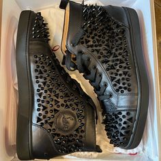 Elevate Your Shoe Game With These Black Louis Mid-Top Spiked Leather Laboutin Sneakers From Christian Louboutin. Designed For Men, These Casual Shoes Feature A Sleek And Stylish Design That Is Perfect For Any Occasion. The Upper And Outsole Are Made Of High-Quality Leather, Ensuring Durability And Comfort. With A Us Shoe Size Of 12, These Sneakers Are Perfect For Any Man Looking To Add A Touch Of Sophistication To Their Wardrobe. The Black Color And Spiked Design Add A Touch Of Elegance And Edginess To Any Outfit. Don't Miss Out On The Chance To Own These Amazing Sneakers. Mid Top, Box Color, Men Looks, Louboutin Shoes, Shoe Game, Christian Louboutin Shoes, Shoes Black, High Quality Leather, Mens Shoes Sneakers