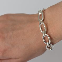 These substantial, heavy, stunning chain bracelets match our Double Link Chain necklaces.  Both are absolutely on trend right now.A large solid oval link is connected with a small oval link and the bracelet is fixed with a hammered silver toggle.The metal is recycled brass with a strong e-coating of recycled sterling silver, which means that it will last a very long time. Match it with our Double Link Silver chain for a co-ordinated look.All Gem Bazaar jewellery comes in a handsome, branded, rec Silver Link Bracelet, All Gems, Chain Bracelets, Silk Sari, Silver Chain Bracelet, Chain Necklaces, Fantasy Jewelry, Hammered Silver, Recycled Sterling Silver