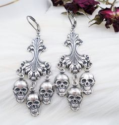 This listing features my handmade skull earrings - made with antique silver plated BRASS metal - all elements are HOLLOW on the back making these earrings bold and large but light and comfortable! The chandelier connectors are high quality and done in the Rococo Victorian style.  The length is 2 3/4 inch long including the stainless steel ear wires.  Width is 1 1/4 inch.  Thank you - also in brass metal- click here to enter my Etsy shop:  www.etsy.com/shop/hhjewelrydesigns Nickel-free Silver Jewelry For Alternative Fashion, Gothic Skull Shaped Pierced Earrings, Gothic Skull Earrings, Gothic Skull Metal Earrings, Vintage Skull Print Jewelry For Halloween, Gothic Nickel-free Earrings For Alternative Fashion, Silver Skull Earrings With Skull Print, Handmade Gothic Earrings For Festival, Silver Steampunk Jewelry For Alternative Fashion