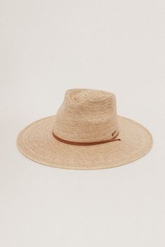 DESCRIPTION Crafted with exotic Guatemalan Palm Straw and hand shaped in Texas, USA, the Monterrico is a sturdy, toasted colored straw hat shaped into a teardrop fedora crown and wide, flat brim that offers amazing sun protection. Trimmed with a brown, genuine leather chinstrap and leather slider, the Monterrico is the perfect summer companion, and is built to stick with you for years to come. UPF Rating: 50 + (Excellent) HAT SIZE CHART Available in 55 S, 57 M, 59 L, 61 XL and 63 XXL. Due to the Natural Color Fedora With Flat Brim For Warm Weather, Brown Panama Hat With Curved Brim For Warm Weather, Brown Fedora With Curved Brim For Vacation, Brown Curved Brim Panama Hat For Warm Weather, Brown Curved Brim Fedora For Vacation, Adjustable Short Brim Coastal Fedora, Coastal Fedora With Adjustable Short Brim, Adjustable Flat Brim Fedora In Palm Leaf, Adjustable Short Brim Palm Leaf Fedora